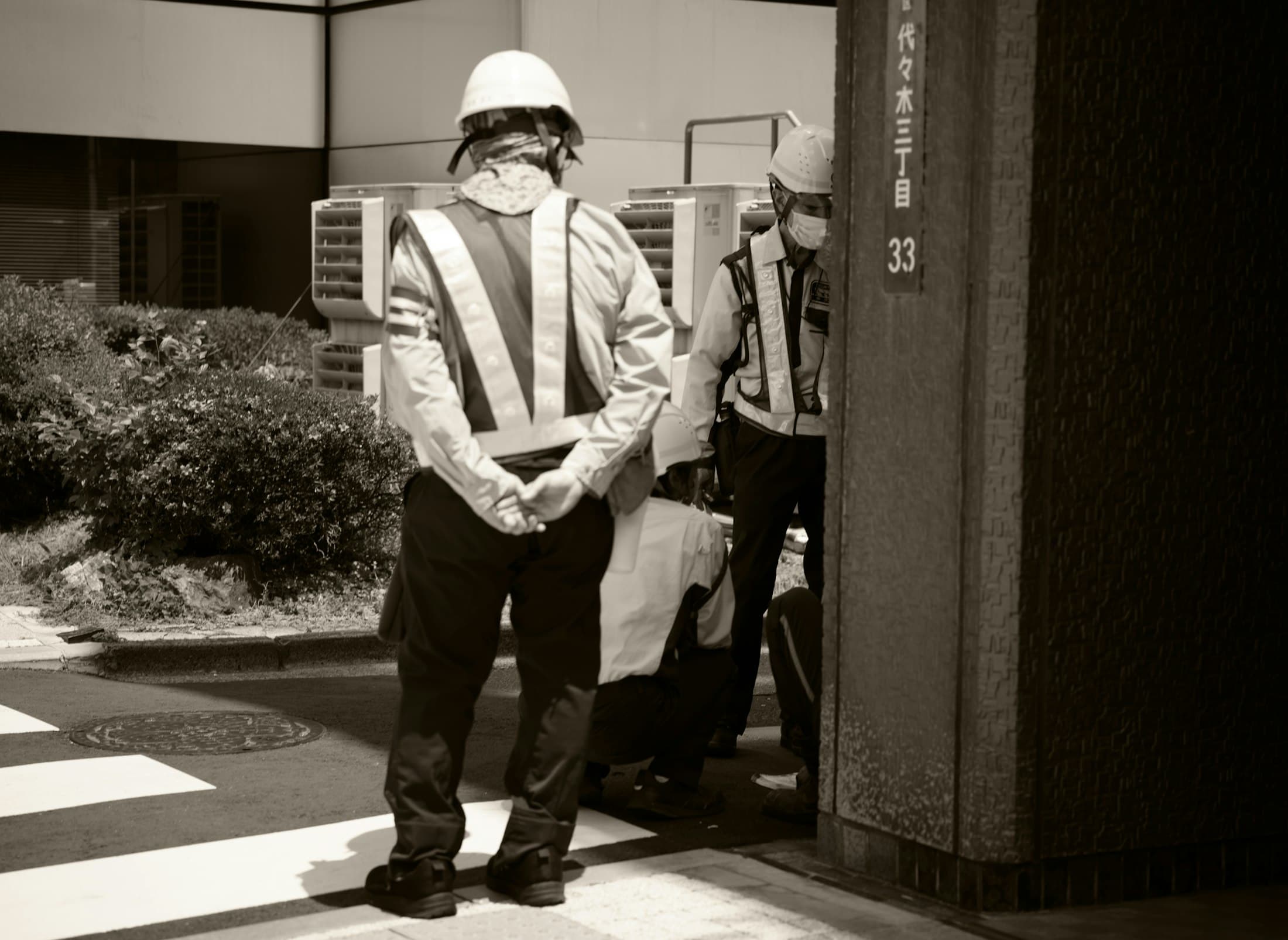 Site inspectors in safety vests and helmets
